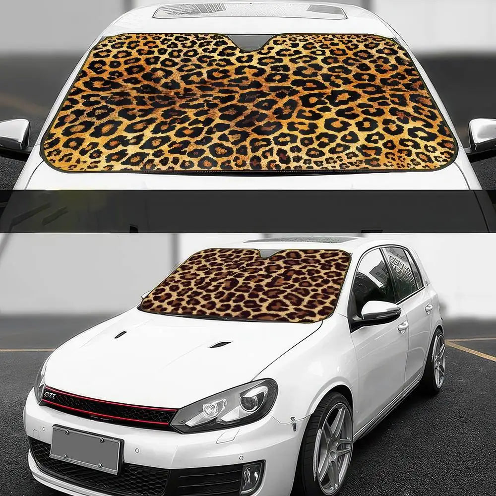 A white car with a leopard print sunshade installed on the front windshield.