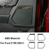 Close-up of a black carbon fiber grain interior trim piece for a Ford F150 vehicle.