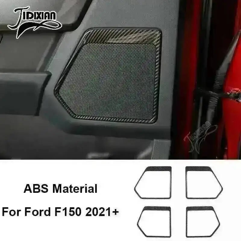 Close-up of a black carbon fiber grain interior trim piece for a Ford F150 vehicle.