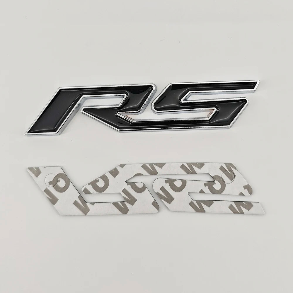 A silver and black 3D metal SS/RS emblem badge for Chevrolet vehicles.