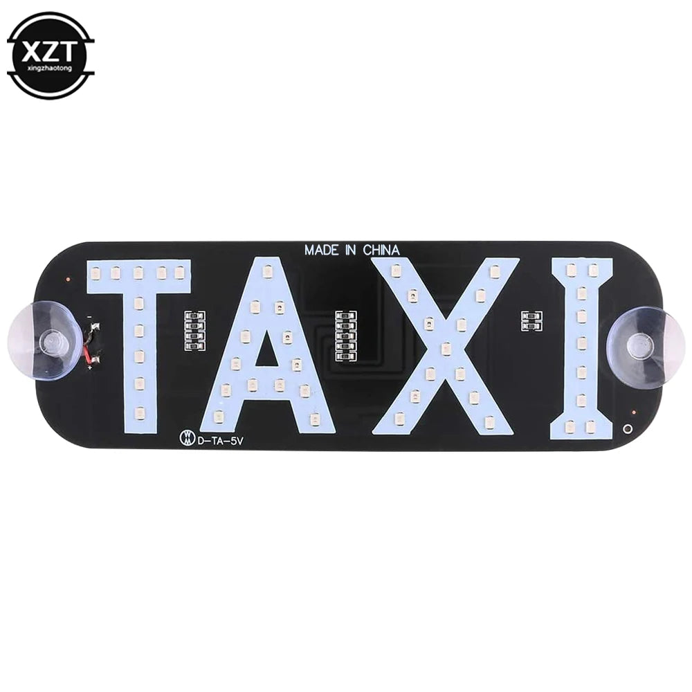 Black LED taxi indicator light featuring the word TAXI in white letters and round lenses.