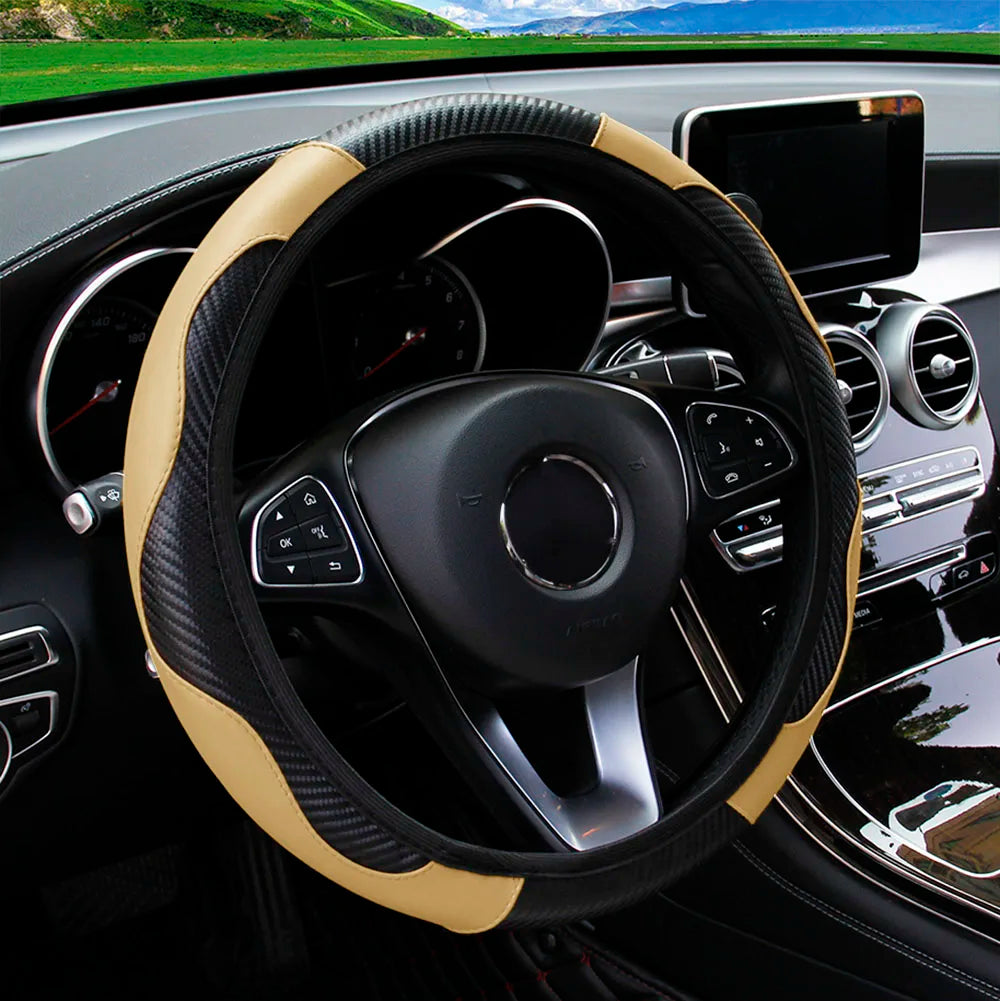 Close-up of a black steering wheel with a tan PU carbon fiber cover inside a car interior.