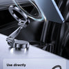 A smartphone is mounted on a magnetic suction ring for a car, demonstrating a stable magnetic field.