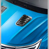 Close-up of a blue car hood with a black decorative air intake vent.