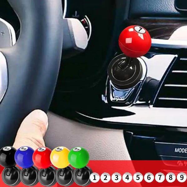 Close-up of a car ignition key and various colored buttons for a personalized lucky number start button cover