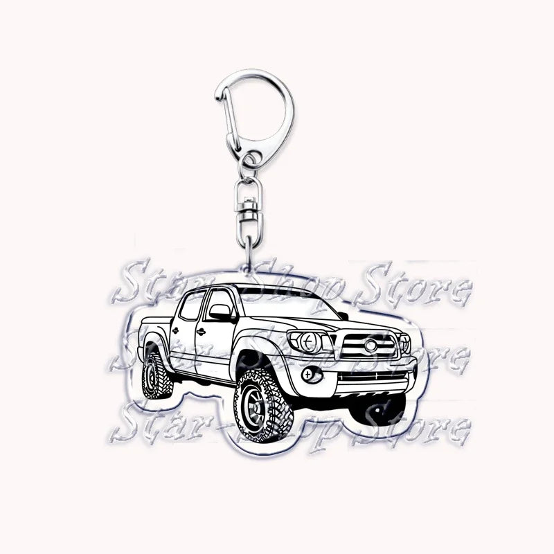 Silver acrylic keychain featuring a detailed model of an off-road truck.