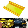 Golden yellow PVC film used to tint and stretch headlights and taillights on a car.