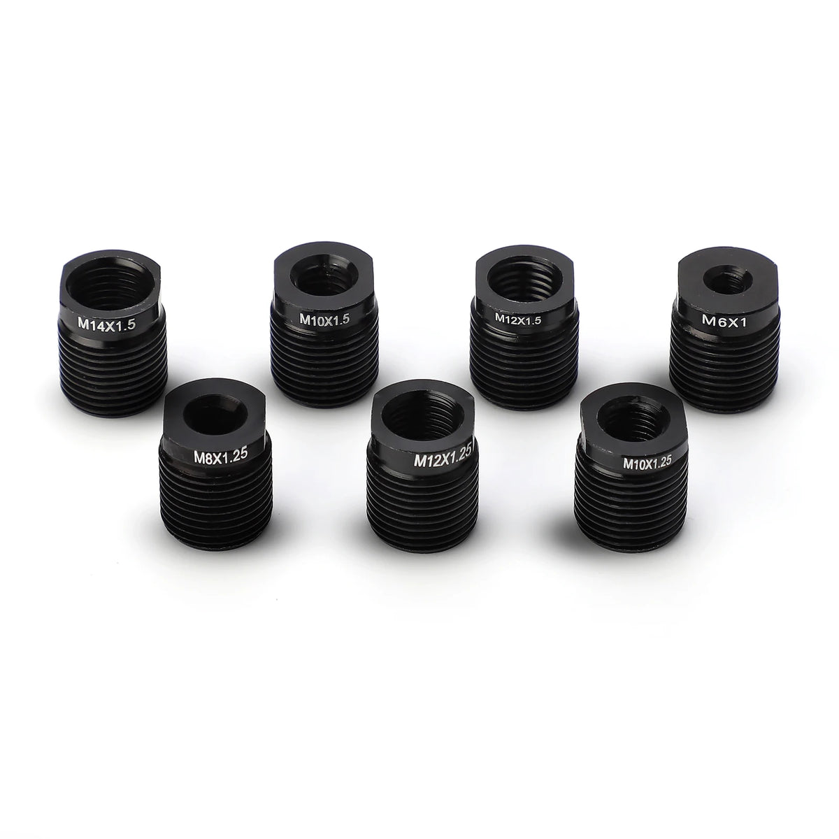 A collection of various black hexagonal shift knob adapters with different sizes and thread pitches.