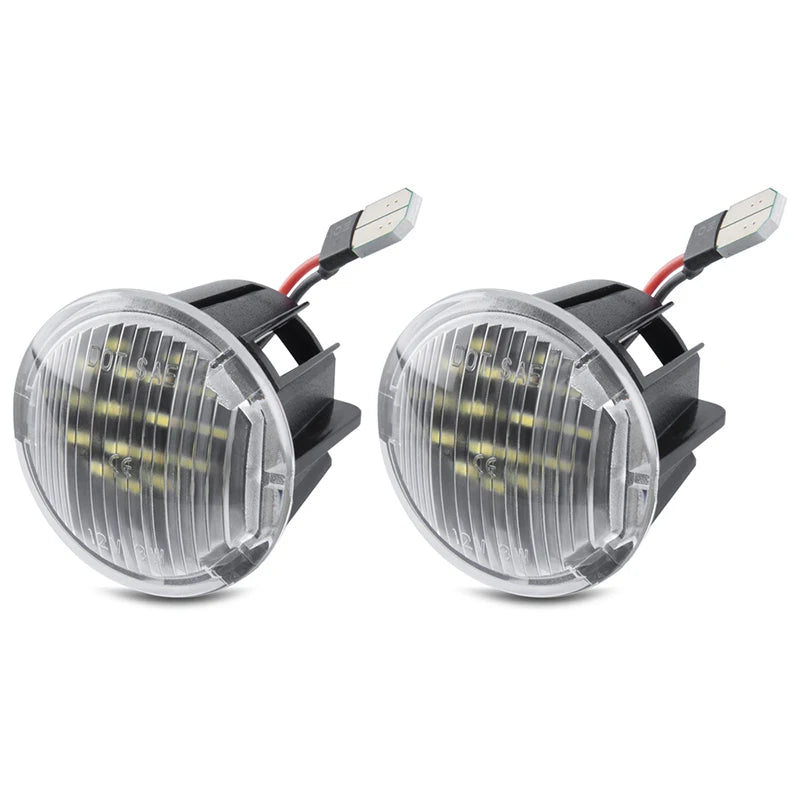 A pair of LED cargo trunk lights with clear lenses and wiring for select Jeep, Chrysler, and Dodge models