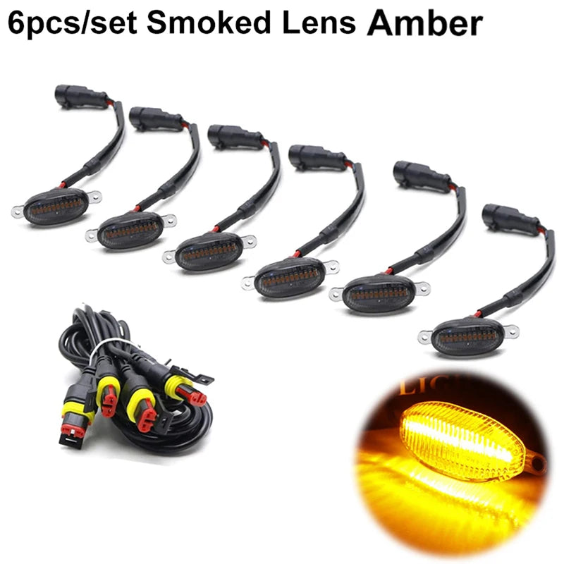 Seis juegos de luces de marcado LED ámbar ahumado para parrillas de camiones y SUVs, mostrando las luces y el cableado.