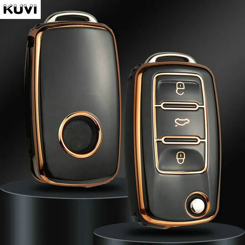 A black TPU car key cover with a gold accent is shown in a studio setting.