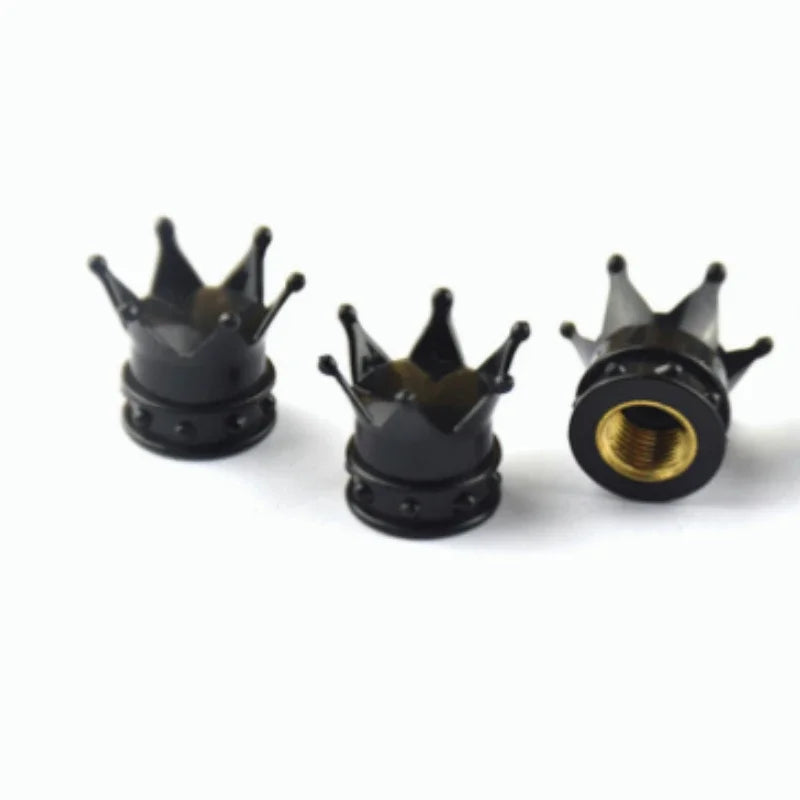 Deux bouchons universels noirs pour valves de roues, vue de dessus des bouchons filetés.