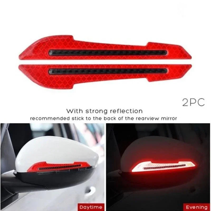 Two red reflective strips designed to be stuck to the back of a rearview mirror for improved visibility