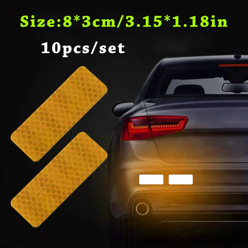 Ten yellow reflective safety strips shown next to a dark car body.