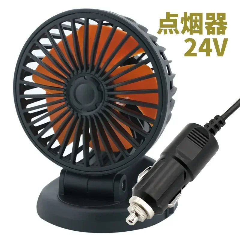 A black electric fan with an orange blade and a power cord, labeled for 24V operation.