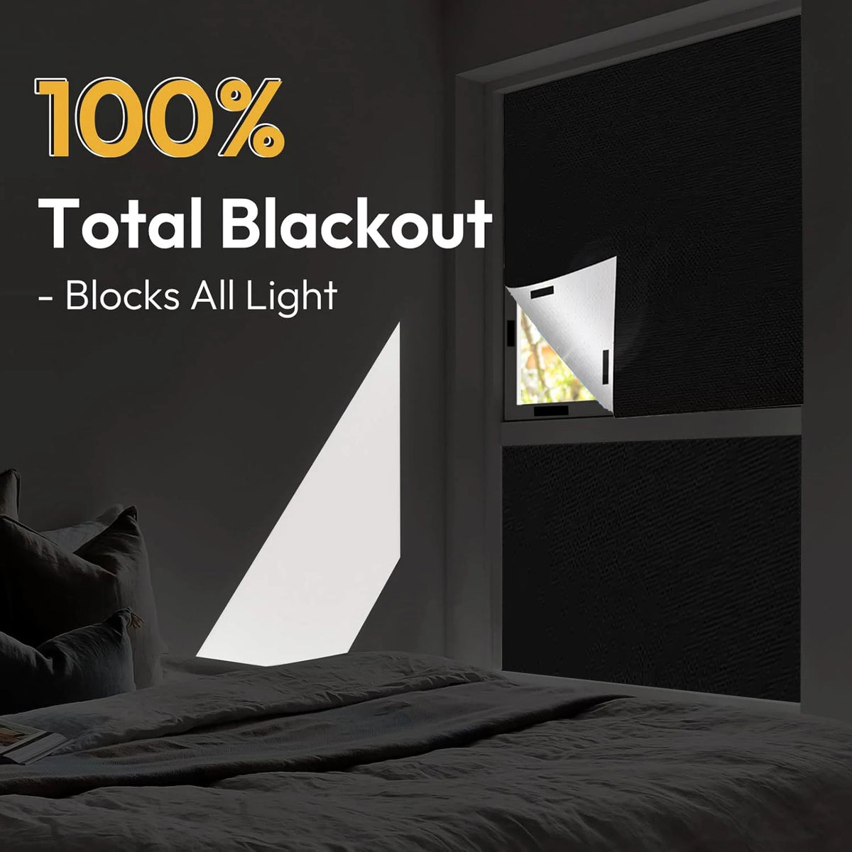 A close-up of a black blackout window shade installed in a room, demonstrating its light-blocking capability.