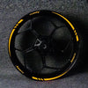 A close-up view of a black sports motorcycle wheel with yellow reflective decals.