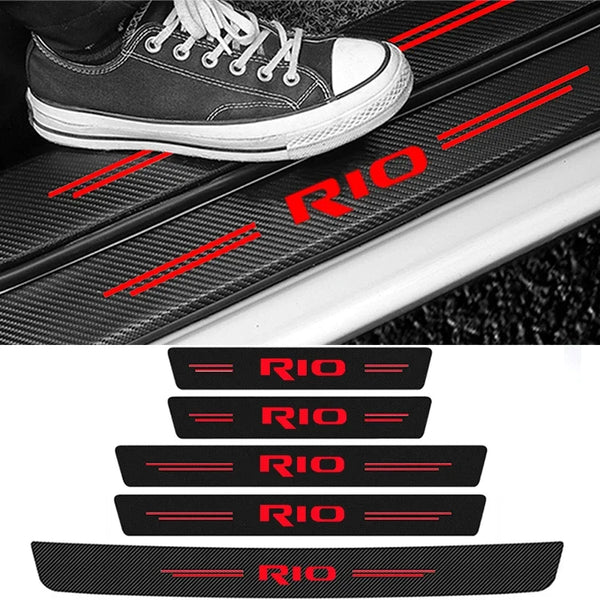 Black carbon fiber decals featuring the RIO logo applied to a car door threshold.