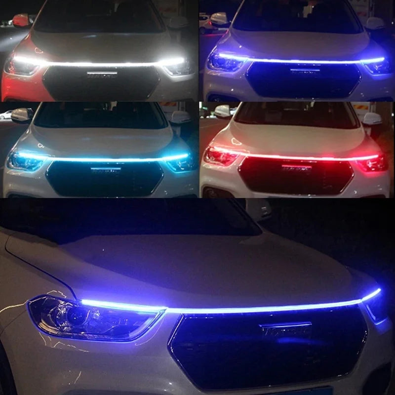 Primer plano del capó de un coche blanco con luces diurnas LED azules.