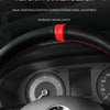 Close-up of a car steering wheel showing a return marker design feature.
