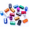 A collection of colorful aluminum alloy tire valve caps for auto and motorcycle use.
