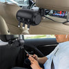 A black retractable car headrest charging cable is shown being used to charge a smartphone in a vehicle.