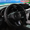 Black crystal carbon fiber steering wheel cover installed in a car interior.