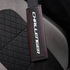 Black leather car seat belt shoulder strap pad with red stitching