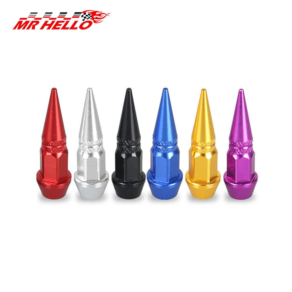 Une rangée de neuf bouchons de tige de valve en aluminium universels de différentes couleurs : rouge, argent, noir, bleu, jau