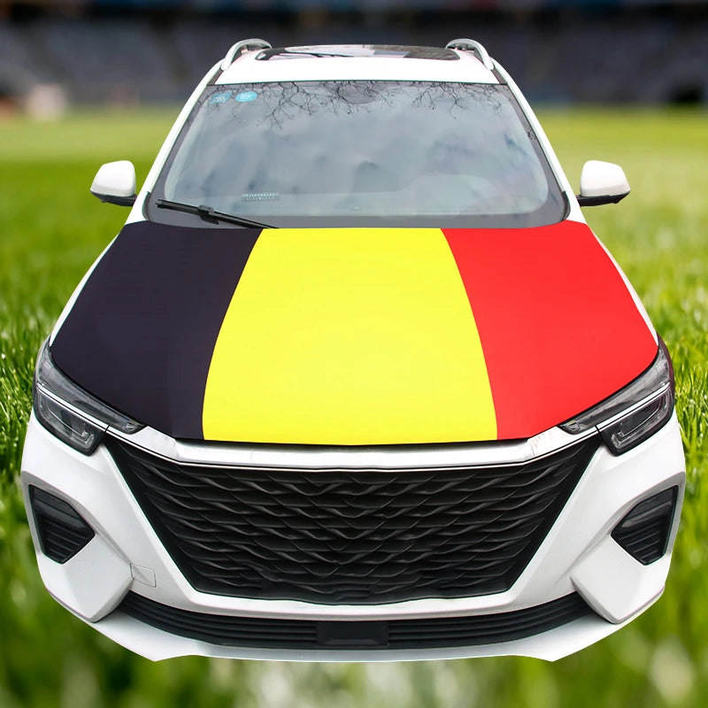 White car hood decorated with a flag featuring black, yellow, and red horizontal stripes.