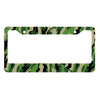 A rectangular license plate cover with a camouflage pattern featuring green, brown, and black colors.