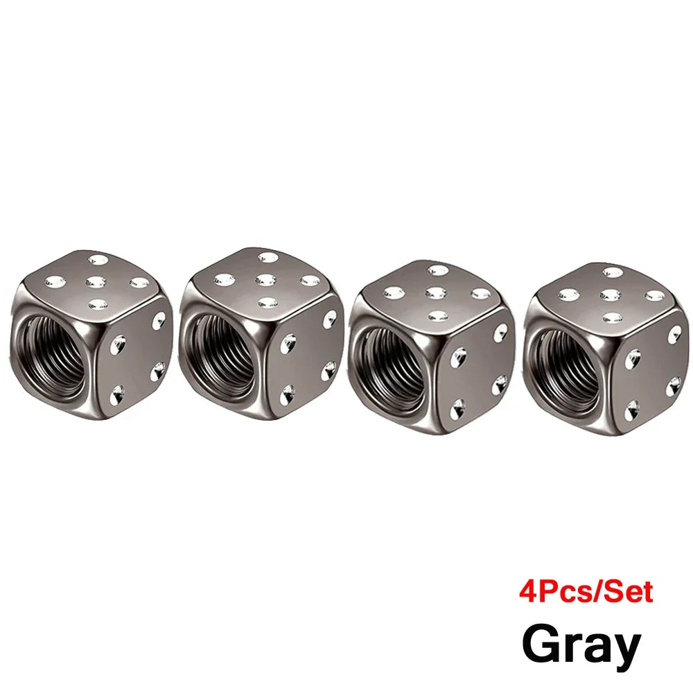 Set of four gray aluminum dice valve caps for tires