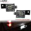 OEM style license plate lights for GMC Sierra trucks shown next to the installed light.