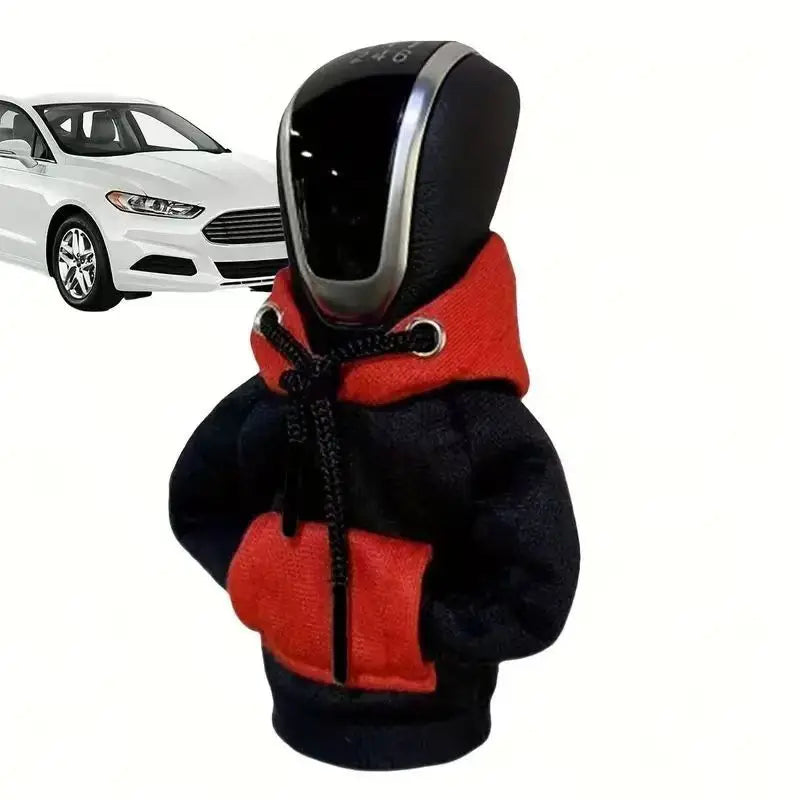 A black and red cozy knit cover designed to fit a gear shift for a manual transmission vehicle.