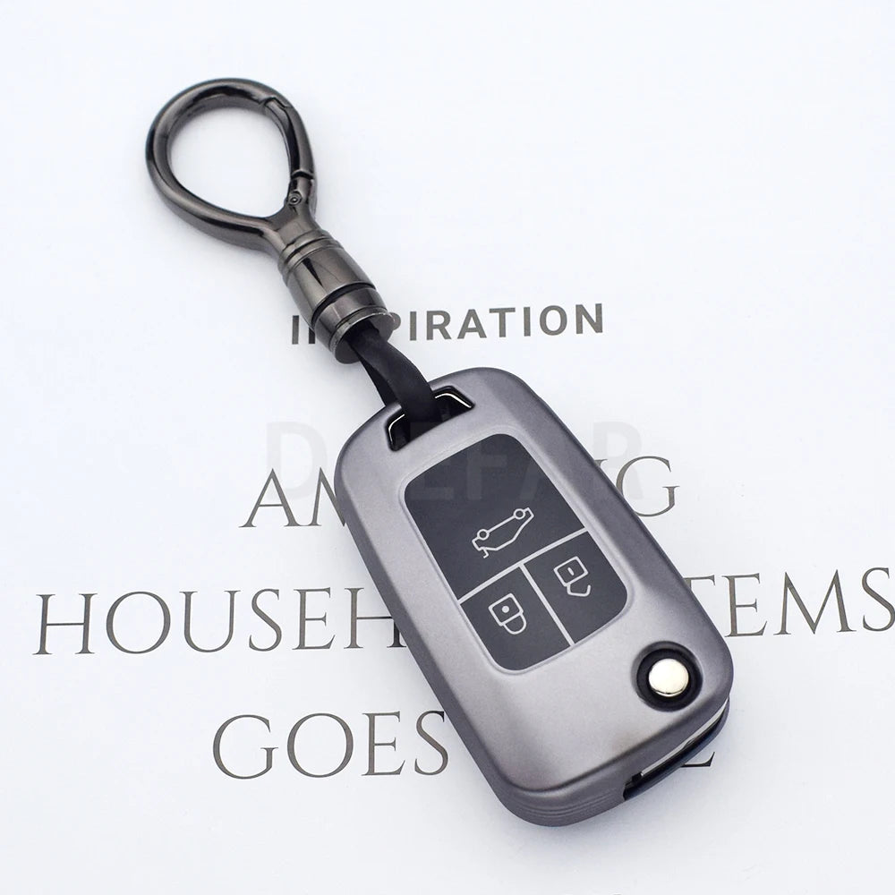 A silver universal car key cover with a black lanyard and key fob is shown against a white background.