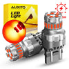 A package of AUXITO LED Light products and a silver strobe brake light bulb with dual sockets.