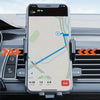 A smartphone displaying a navigation map and driving stats is mounted on a car's dashboard.