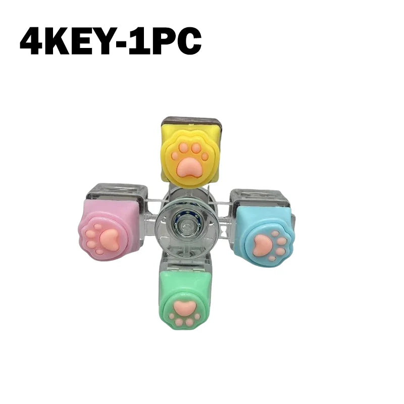 A set of four silicone paw-shaped LED keychains for stress relief and fidget toys.