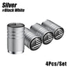 A set of four silver aluminum tire valve caps featuring an American flag design.