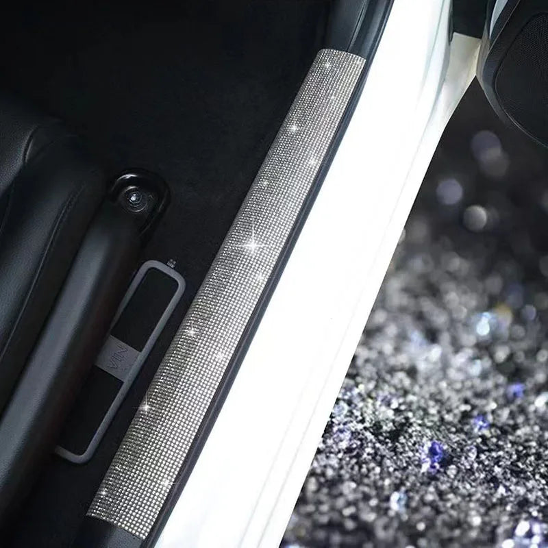 Close-up of a decorative diamond trim strip with LED lighting on a car interior panel.