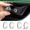 A set of clear lens protectors for a universal car camera, shown next to the installed lens.