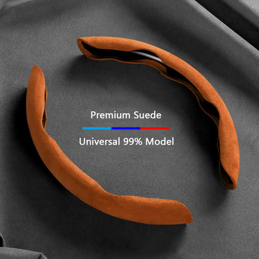 A brown suede steering wheel cover shaped like a curved piece of leather, shown against a dark gray background.