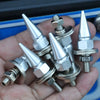 A hand holds several silver and stainless steel M6 license plate screws and bolts.