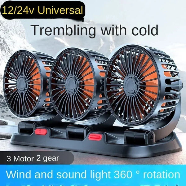 Three black car cooling fans with orange blades are shown rotating on a stand.
