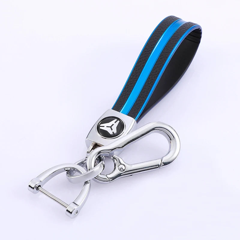 A black and blue multi-function key fob holder with a silver split ring attached.