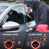A person is using a high sensitivity sensor alarm device on a car, with warning and alarm modes displayed below.