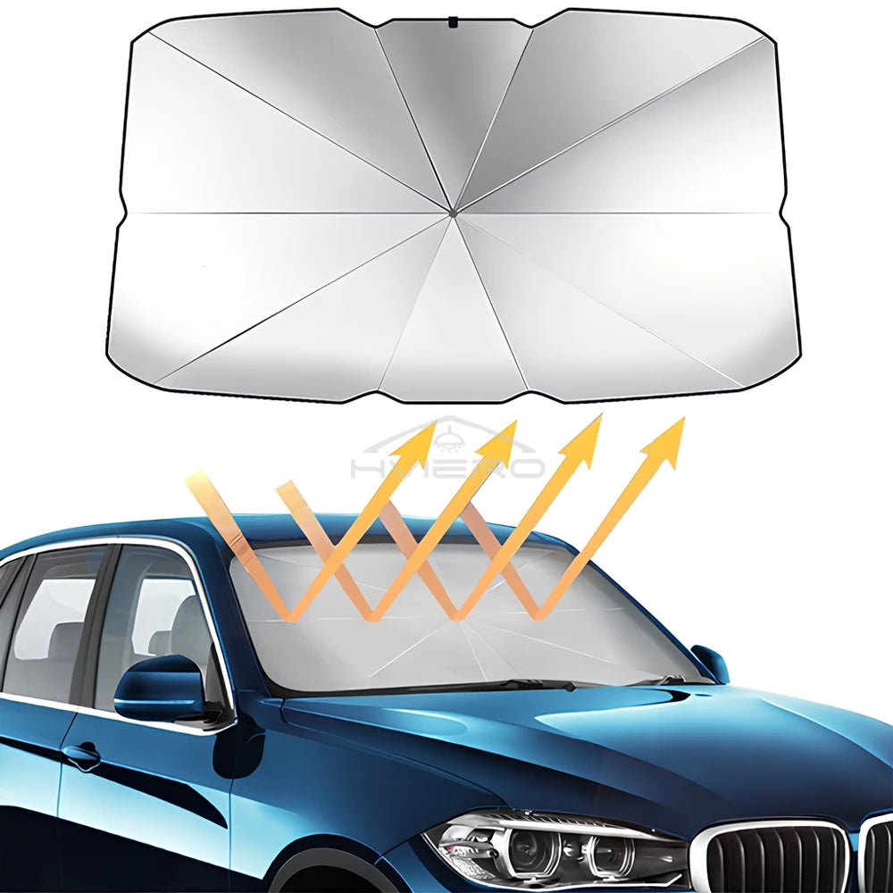 Un pare-soleil pliable pour pare-brise est placé sur la vitre d'une voiture bleue.