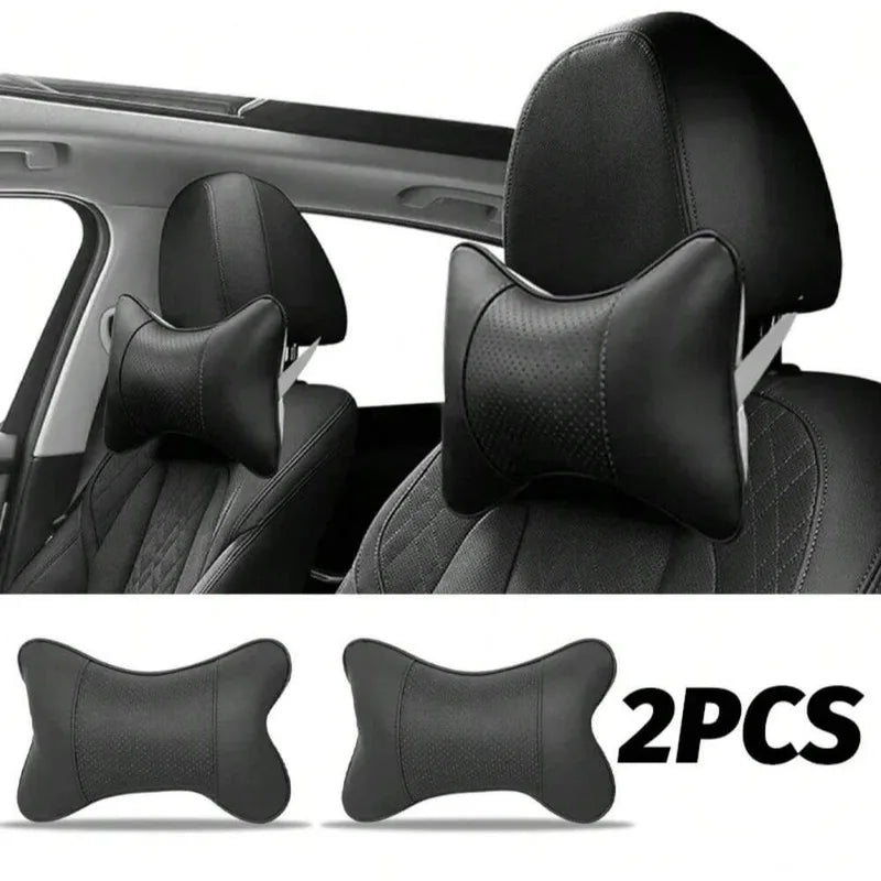 Two black ergonomic auto headrest cushions designed for neck support.