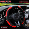 Red and black carbon fiber steering wheel cover installed in a car interior.