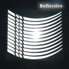 A white reflective pattern resembling curved lines and stripes on a dark background.